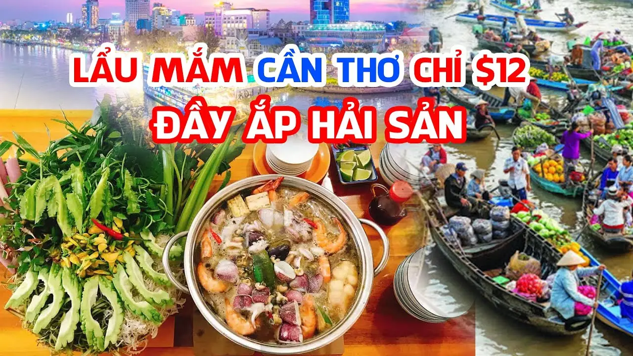 Bàn ăn đầy ắp lẩu mắm, rau, hải sản.